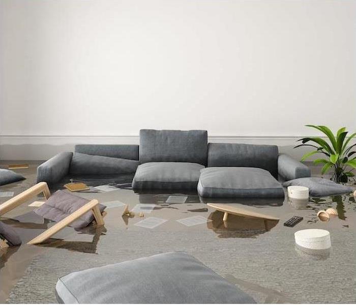 Flood water is shown indoors with some furniture soaked 
